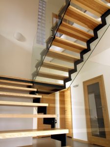 Wooden glass staircase in modern interior