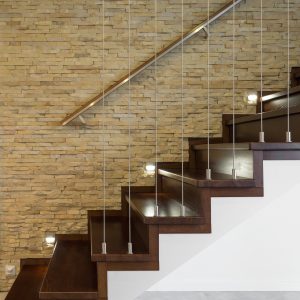 Wooden stairway and brick wall